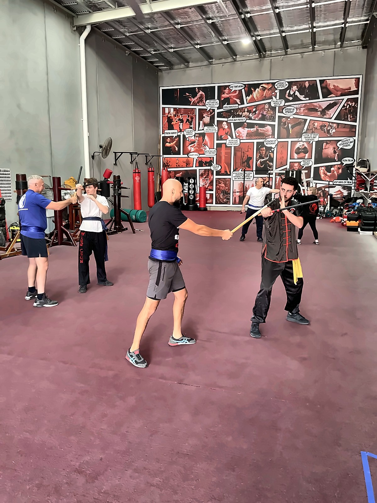Men practising Wing Chun techniques in the academy